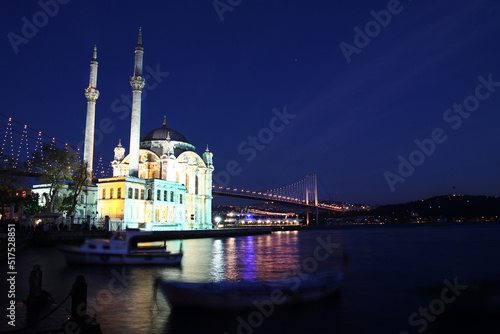 Istanbul Ortakoy Mosque at night with Bosphorus Bridge on the background