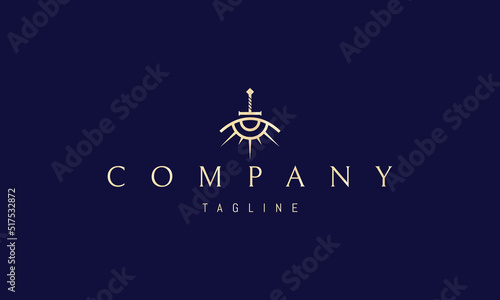 Vector golden logo on which an abstract image of an eye in the form of a sun and a sword in the middle.