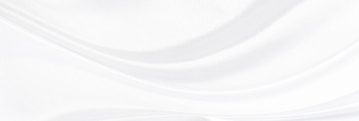 White gray satin texture that is white silver fabric silk panorama background with beautiful soft blur pattern natural.