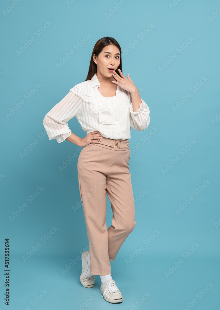 Young beautiful asian woman with smart casual cloth smiling with excitement isolated on blue background Young beautiful asian woman with smart casual cloth smiling with excitement isolated on blue background