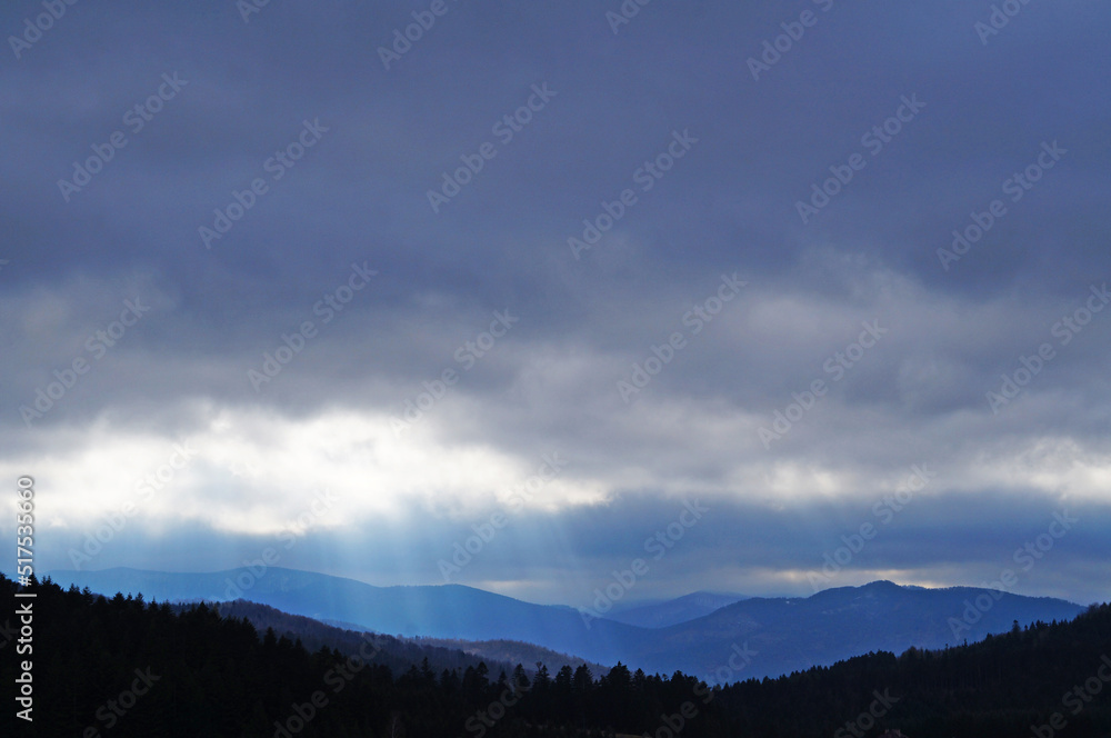 View of the autumn Carpathian mountains under the sky with white and gray clouds on a cloudy autumn day View of the autumn Carpathian mountains under the sky with white and gray clouds on a cloudy autumn day