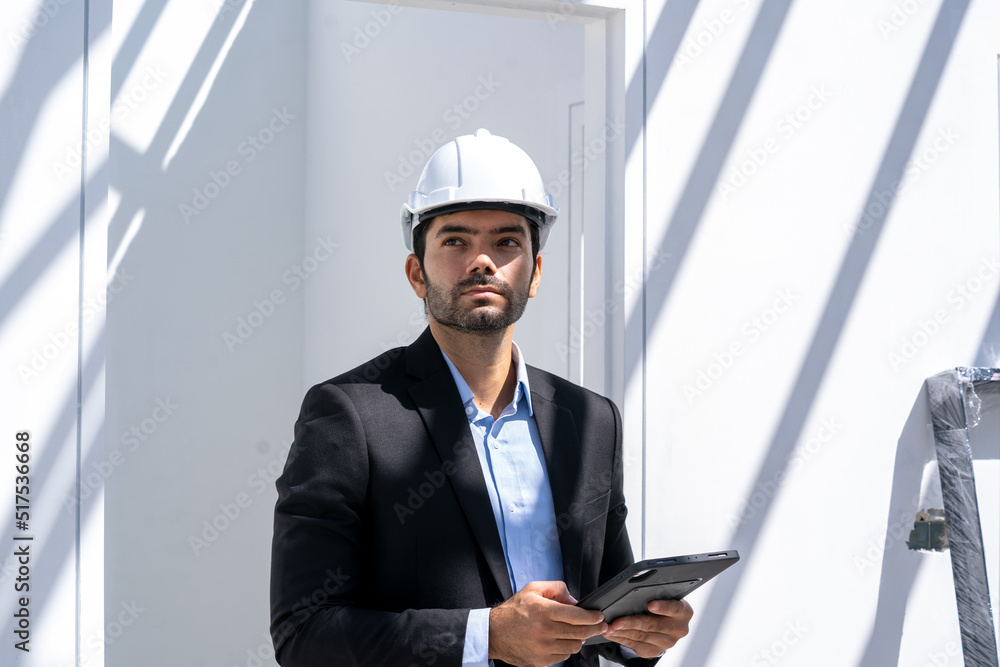 Architects checking the construction progress of the housing project,Concept of architect profession and house building. Architects checking the construction progress of the housing project,Concept of architect profession and house building.