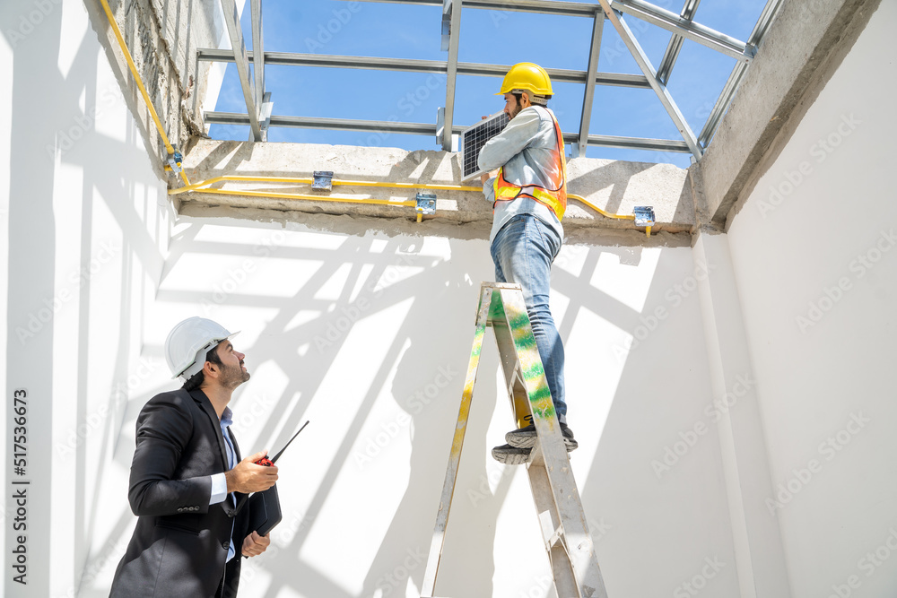 Engineer and Businessmen are checking solar panels to prepare for installation in a new home,Renewable energy for residential. Engineer and Businessmen are checking solar panels to prepare for installation in a new home,Renewable energy for residential.