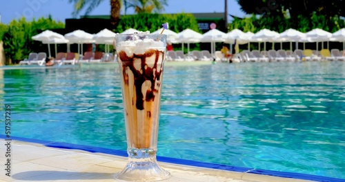 A photo of an ice cream on the poolside