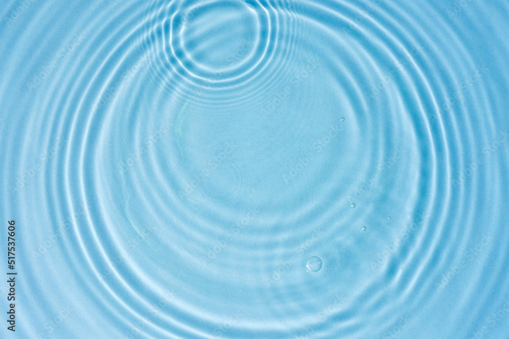 Blue water texture, blue mint water surface with rings and ripples. Spa concept background. Flat lay, copy space.