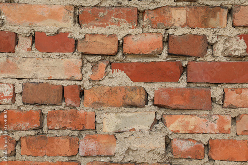 Texture of old red brick wall as background © New Africa