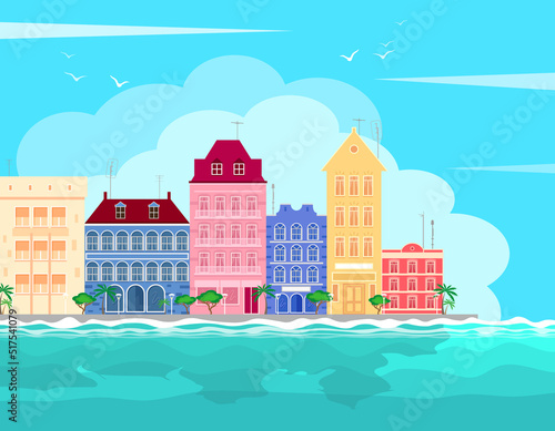 Sea tropical cityscape with colorful buildings on the seafront against the backdrop of azure waves and blue sky