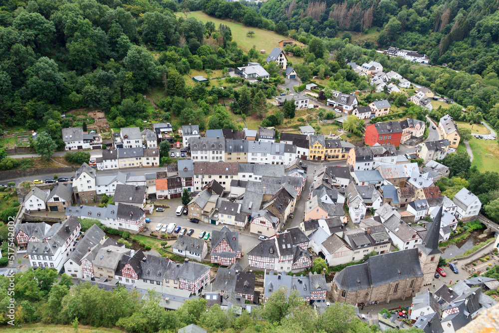 Panorama view on Eifel village Monreal with half-timber houses and river Elsbach, Germany