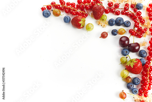 Various fresh summer berries frame on white background. Top view