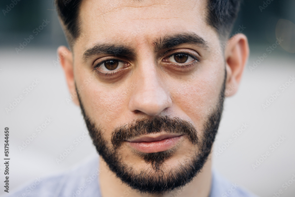 Fototapeta premium Portrait of nice-looking caucasian multi-race beautiful businessperson elegant young man looking into camera. Career people. Fashion, beauty. Male portraits.