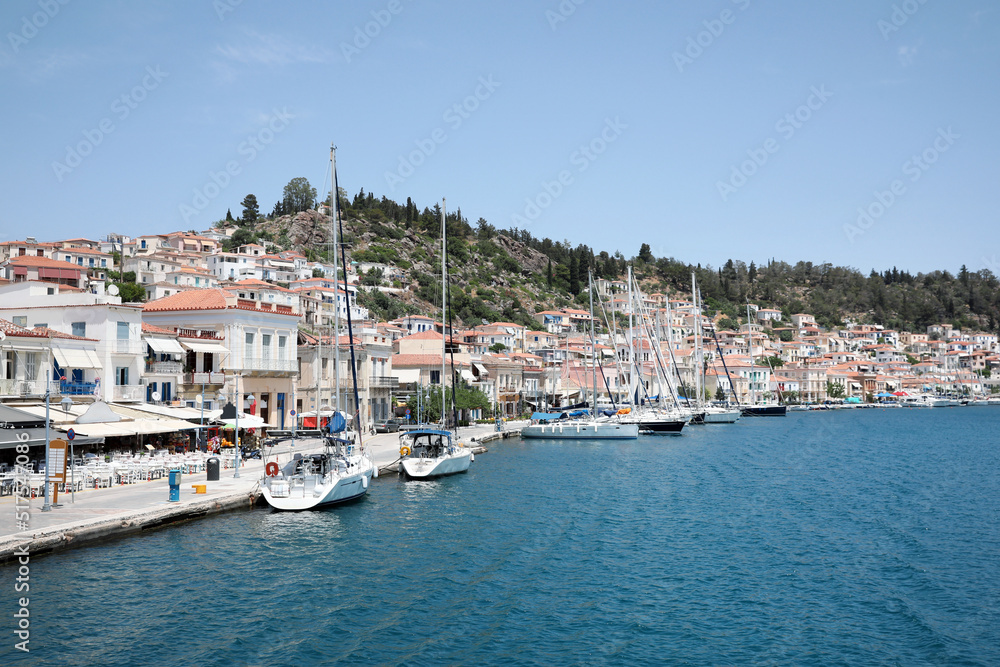 Beautiful view of coastal city with boats on sunny day