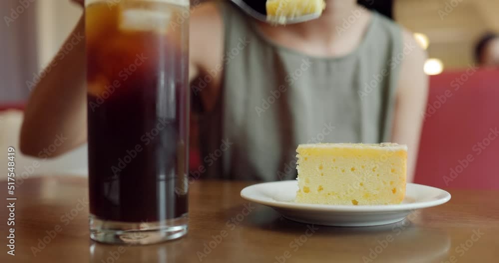 Woman enjoy her slice of cake in coffee shop Woman enjoy her slice of cake in coffee shop