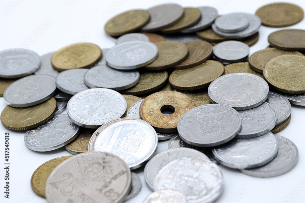 scaterred pesetas spanish old coins on white background scaterred pesetas spanish old coins on white background