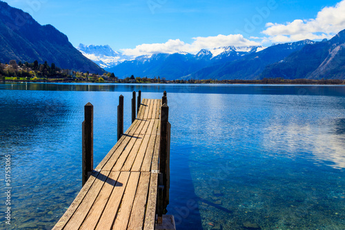 Wooden pier overlooking the Alps and Lake Geneva in Switzerland