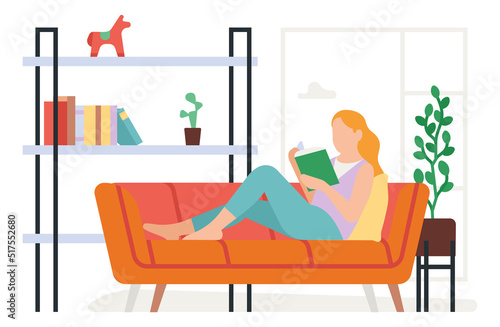 Woman reading book on sofa. Home leisure time