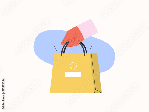 Electronic commerce -Online shopping and electronic commerce series -modern flat vector concept illustration of a hand holding paper shopping bag. Promotion, discounts, sale and online orders concept