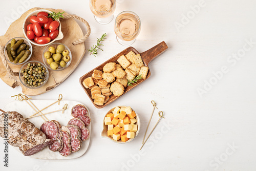 Schilderij op canvas Appetizers table with different antipasti, charcuterie, snacks, cheese