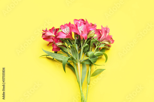 Bouquet of alstroemeria flowers on yellow background