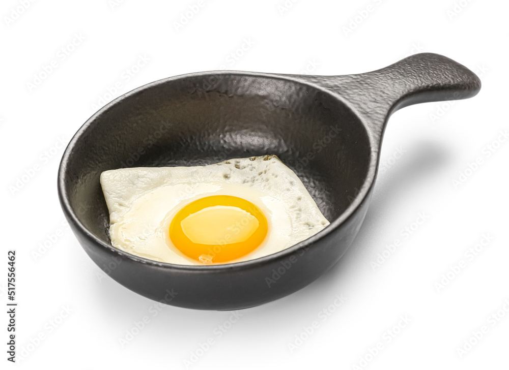 Frying pan with tasty egg isolated on white background Frying pan with tasty egg isolated on white background
