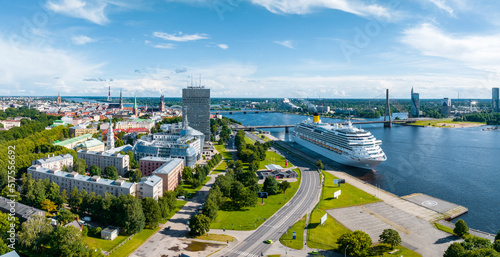 Aerial view of the large cruise ship docked in Riga port, Latvia near the old town and city center.