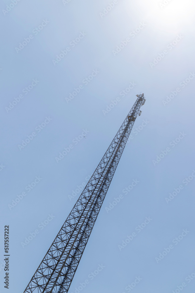 Electric transmission line mast, bottom view, against the sky Electric transmission line mast, bottom view, against the sky