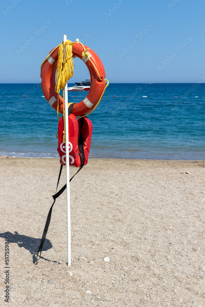 life buoy at the beach, against the sky.