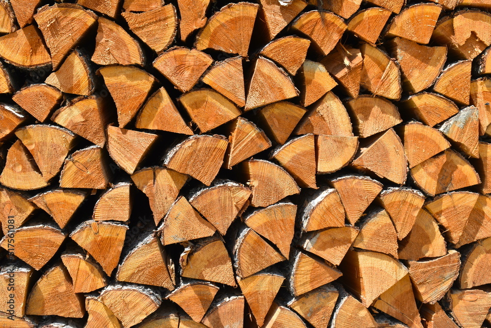 Stack of wood finely chopped in a Canadian mountain resort. The forest sector is major for Canada's economy It is source of income for many It manufactures paper for printing and writing panels lumber Stack of wood finely chopped in a Canadian mountain resort. The forest sector is major for Canada's economy It is source of income for many It manufactures paper for printing and writing panels lumber