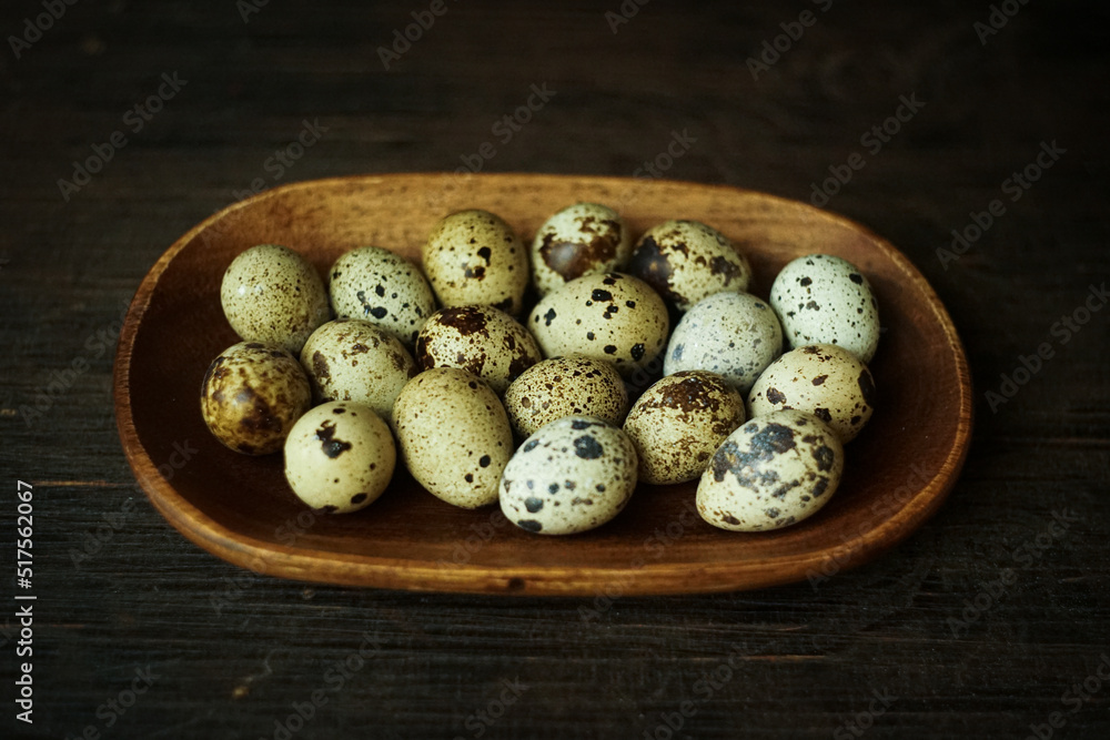 Fresh quail eggs close up on a wooden table small hard boiled eggs rustic top view Fresh quail eggs close up on a wooden table small hard boiled eggs rustic top view