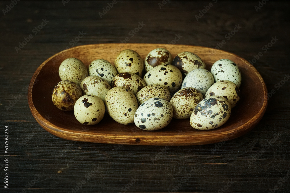 Fresh quail eggs close up on a wooden table small hard boiled eggs rustic top view Fresh quail eggs close up on a wooden table small hard boiled eggs rustic top view