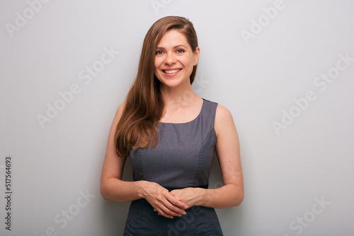 Smiling business woman in dress with folded hands. isolated female business person portrait.