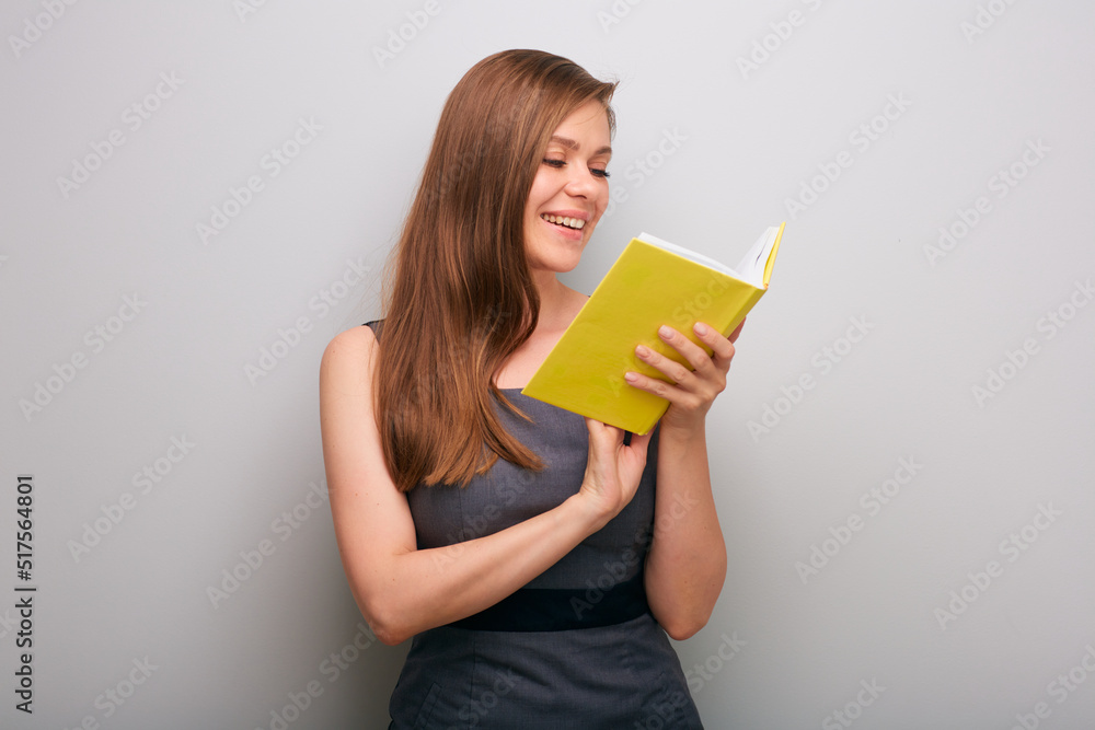 Smiling student woman in dress reading book. isolated female business person portrait. Smiling student woman in dress reading book. isolated female business person portrait.