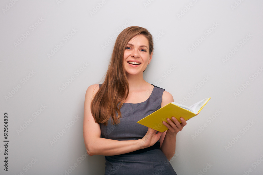 Happy smiling business woman in dress with open yellow book. isolated female business person portrait. Happy smiling business woman in dress with open yellow book. isolated female business person portrait.