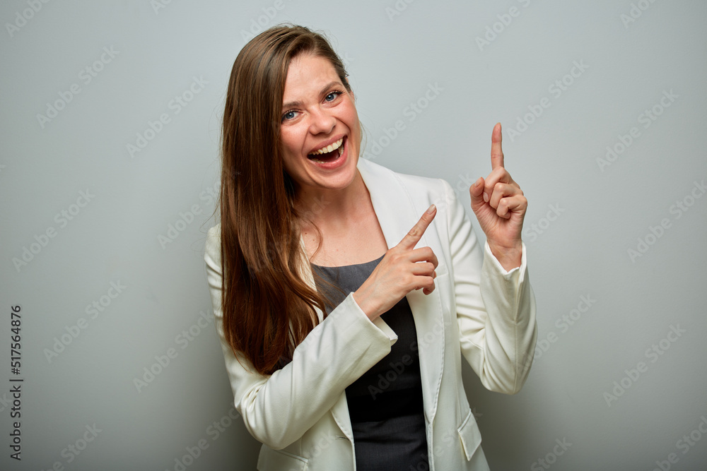emotional woman with mouth open pointing fingers up. isolated female portrait. emotional woman with mouth open pointing fingers up. isolated female portrait.