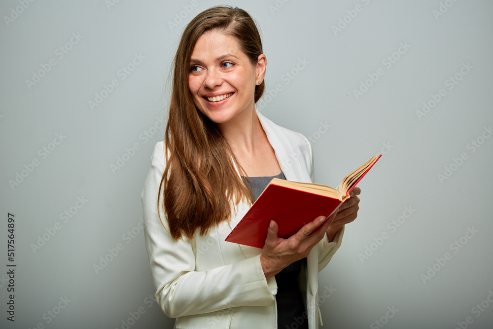 Teacher or female student with red book looking back over shoulders isolated portrait. Teacher or female student with red book looking back over shoulders isolated portrait.
