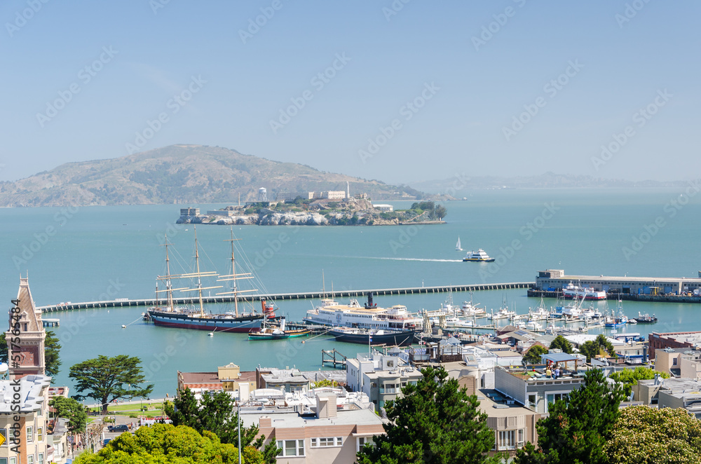 SAN FRANCISCO, CALIFORNIA - 2015, JUNE 24:  view of an iconic tourist attraction, descending a steep hill peak overlooking Alcatraz prison island and the bay