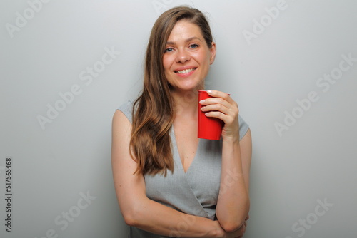Smiling woman with red coffee glass isolated female portrait.
