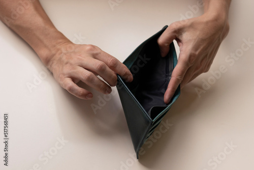 Man hands showing empty wallet