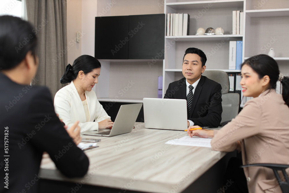 Collaborative process of professional businesspeople going over on new project together, using computer presentation and brainstorming ideas, coworker and working together at office meeting concept Collaborative process of professional businesspeople going over on new project together, using computer presentation and brainstorming ideas, coworker and working together at office meeting concept