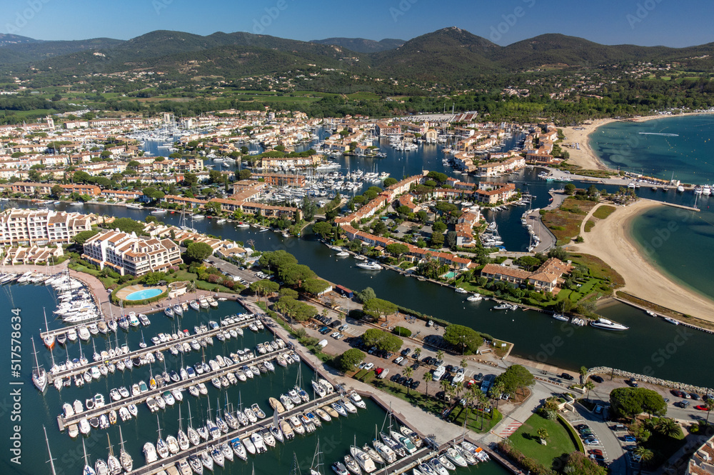 Aerial view on Gulf of Saint-Tropez, sail boats, houses of Port Grimaud and Port Cogolin, summer vacation in Provence, France