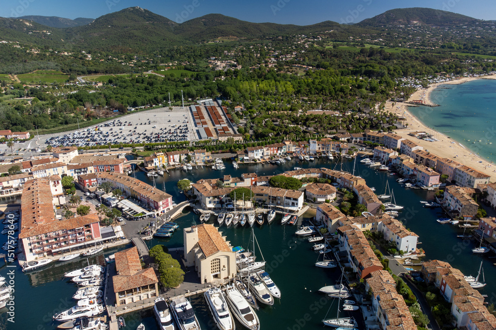Obraz premium Aerial view on Gulf of Saint-Tropez, sail boats, houses of Port Grimaud and Port Cogolin, summer vacation in Provence, France