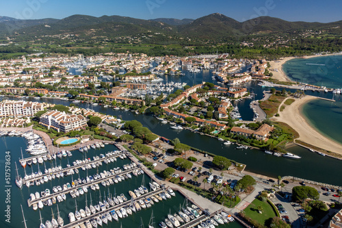 Aerial view on Gulf of Saint-Tropez, sail boats, houses of Port Grimaud and Port Cogolin, summer vacation in Provence, France