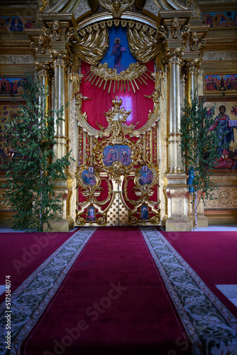 KOLOMNA, RUSSIA - 18 JUNE, 2022: Golden interior of the medieval Orthodox Assumption Cathedral with icons and images of saints in Kolomna, Russia