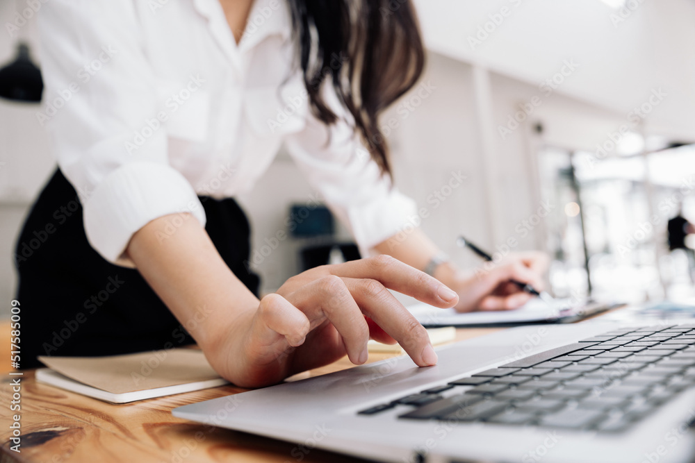 Asian businesswoman working with laptop at office.