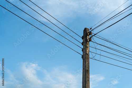 Wallpaper Mural Power poles and power lines and blue sky background. Concept of energy technology, power supply and communication. Old electric pole against the sky. Torontodigital.ca