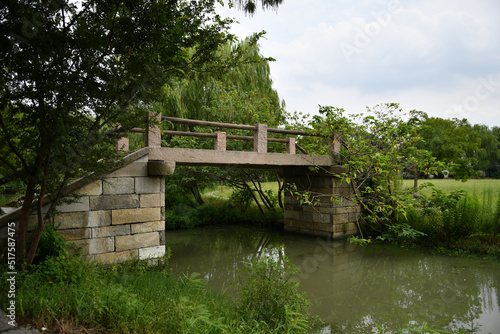 an old stone bridge over a small river