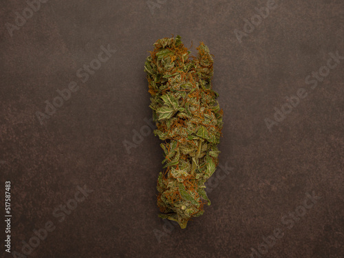 Dry cannabis buds flowers on vintage background. Top view of medical marijuana flower