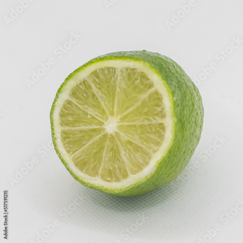 Green lime fruit on a white background