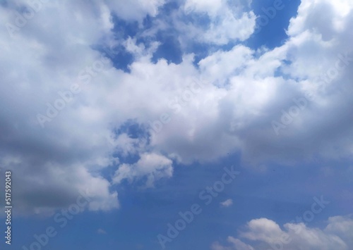 nature portrait of clouds among blue sky in the horizon