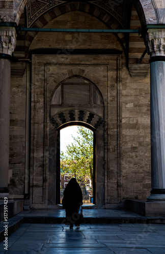 person walking through the gate