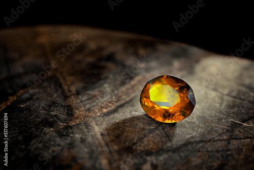 фотографія Citrine Yellow Gemstone on Natural Stone